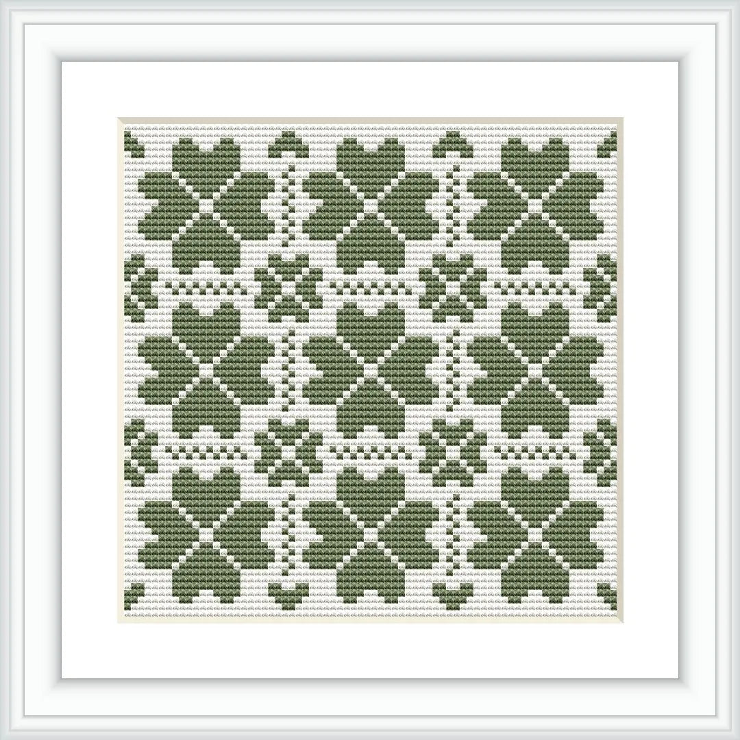 The image presents a framed cross stitch pattern consisting of multiple green clover motifs arranged in a symmetrical grid on a white background.