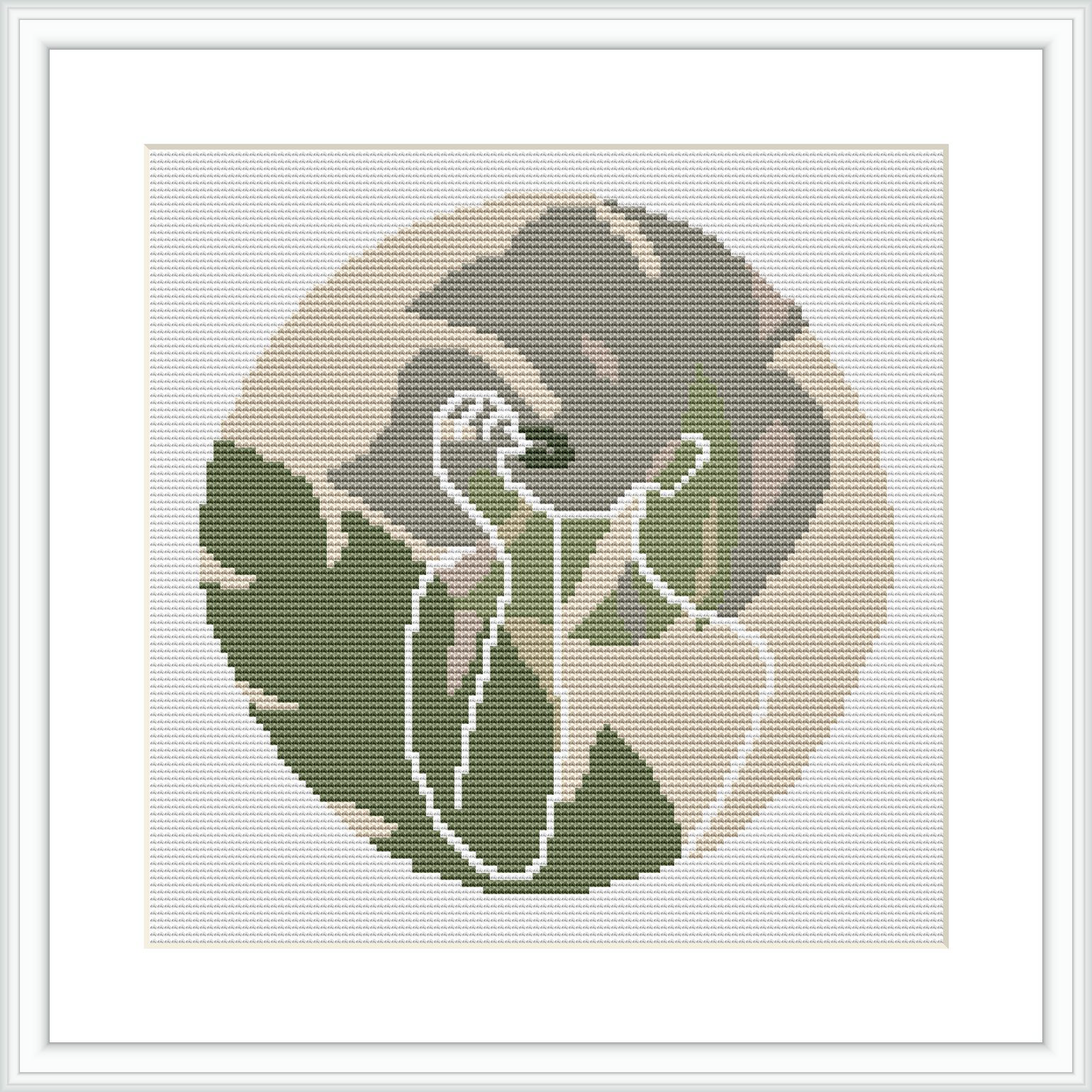 The image depicts a circular cross-stitch pattern framed in white, featuring the minimalist silhouette of a woman against a muted backgrounds with gradients of beige and olive.