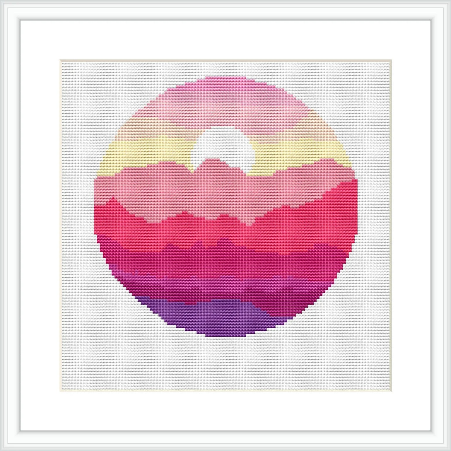 The image displays a circular cross stitch pattern depicting a stylized sunset over a mountain landscape. The pattern is composed of an ombre of colors creating a gradient from yellow at the top through various shades of pink to purple at the bottom. It's framed in a square white frame against a white background.