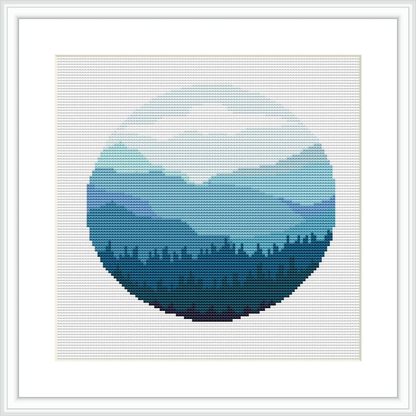 The image depicts a stylized circular cross stitch pattern featuring a green forest landscape. It progresses from a lighter shade of green at the top to darker shades towards the bottom, mimicking the depth of a forest canopy.