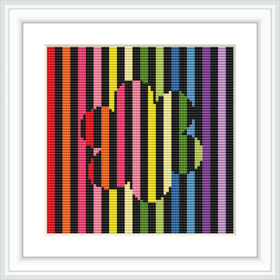 A digital image depicting a cross stitch pattern with multicolored vertical stripes as the background and a stylized flower silhouette overlaid in the center. The pattern is framed within a square, simulated white frame on a white wall.