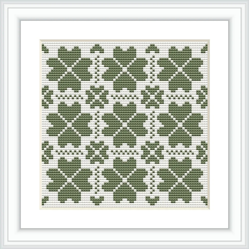The image presents a framed cross stitch pattern consisting of multiple green clover motifs arranged in a symmetrical grid on a white background.