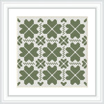 The image presents a framed cross stitch pattern consisting of multiple green clover motifs arranged in a symmetrical grid on a white background.