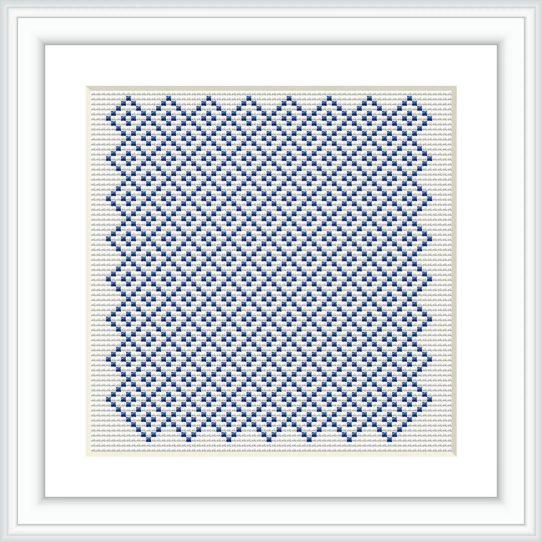 The image showcases a cross stitch embroidery pattern framed in white. It features a geometric design composed of blue stitches on an off-white canvas, creating a tiled effect.