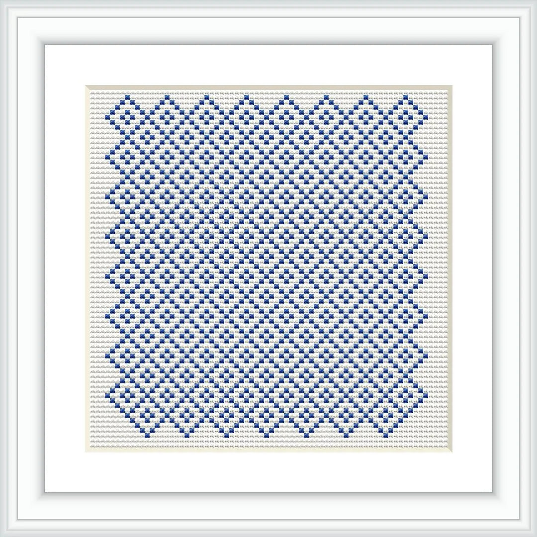 The image showcases a cross stitch embroidery pattern framed in white. It features a geometric design composed of blue stitches on an off-white canvas, creating a tiled effect.