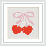 The image features two red hearts tied together with a pink bow. The hearts are hanging down from the ribbon, centered on a white background.