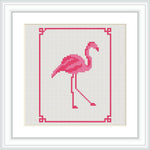 The image features a cross-stitch pattern of a flamingo standing on one leg, elegantly detailed in shades of pink. It is framed with simple, minimalist corner designs in red.