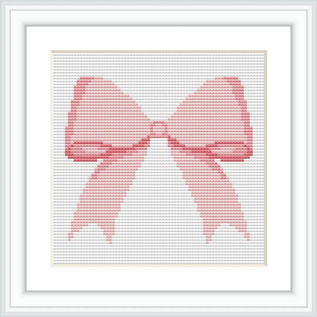 The image shows a cross-stitched pattern in the form of a pink bow. It is framed in a white, square frame, with the bow centered in the middle.