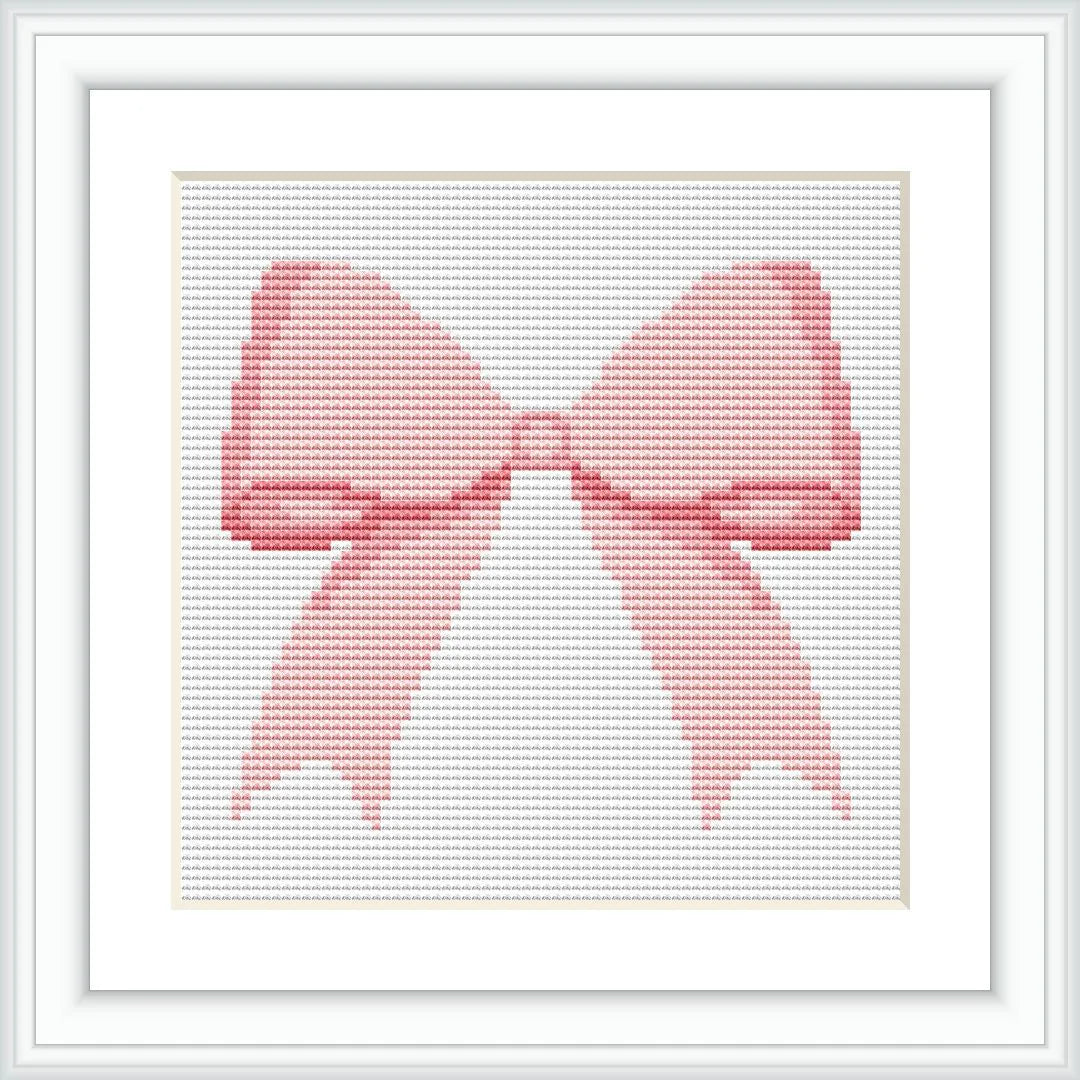 The image shows a cross-stitched pattern in the form of a pink bow. It is framed in a white, square frame, with the bow centered in the middle.
