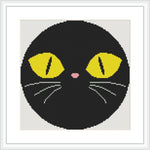 The image features the face of a black cat within a circular border. The cat has large, yellow eyes with black pupils, a small pink nose, and white whiskers.