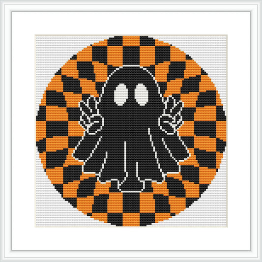 The image depicts a black cartoon ghost with big white eyes, holding up two peace signs with its hands. It is centered within a circular orange and black checkerboard pattern, giving a hypnotic appearance.