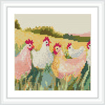 The image shows five chickens in a meadow with a background of fields and a light sky.