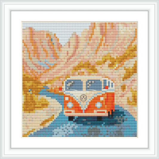 A classic orange VW bus driving through a scenic desert landscape with mountains and a winding blue road.