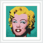 A cross stitch pattern depicting a portrait of a woman with iconic blonde hair against a turquoise background.