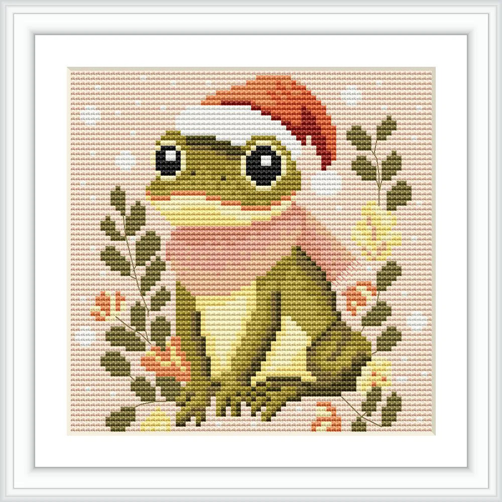 A cute frog wearing a red Santa hat and a pink scarf is sitting among green leaves with small red and white flowers dotting the scene.