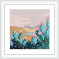 The image depicts a group of green cacti with pink flowers, set against a backdrop of desert mountains and a pale blue sky.