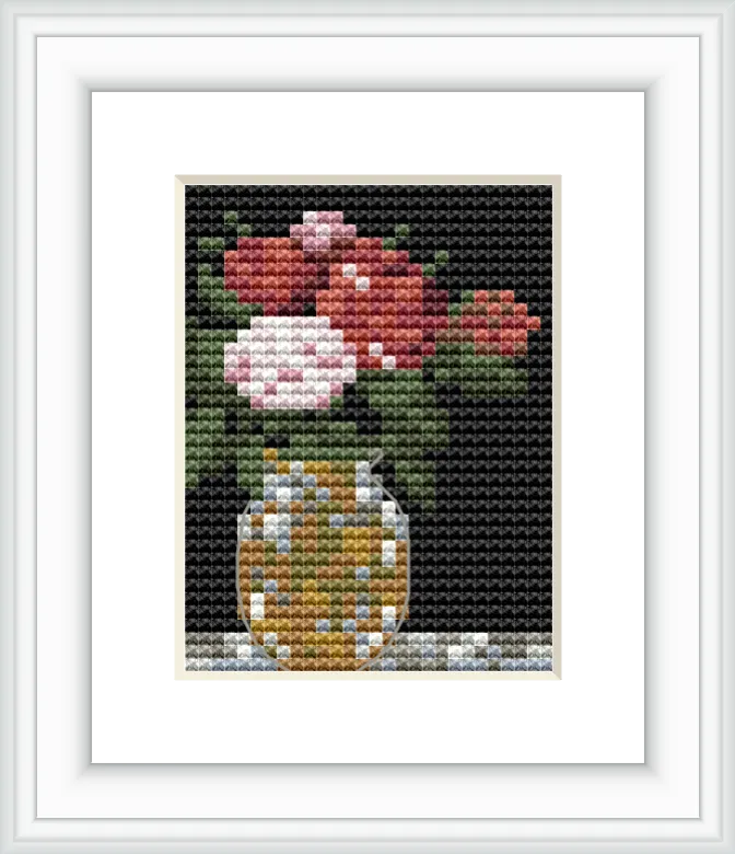 A still life image of a bouquet with red and pink flowers and green leaves placed in a vase, set against a dark background.