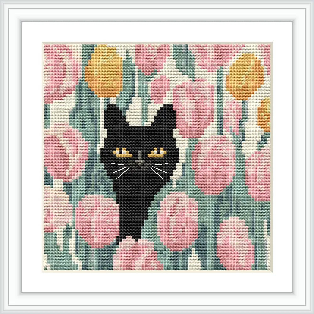 A black cat with yellow eyes peeks through a field of pink and yellow tulips, surrounded by green leaves.