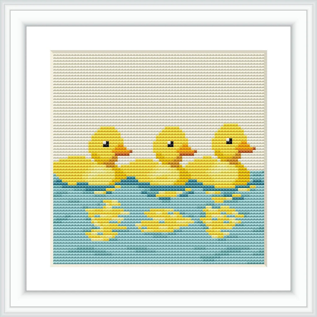 The image features three yellow ducklings with reflections below them, swimming on a blue water surface. They are evenly spaced and oriented in the same direction.