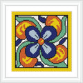 A square cross-stitch design featuring a central blue flower with petals on a white background, surrounded by swirling orange, yellow, and green shapes. The border is framed in yellow.