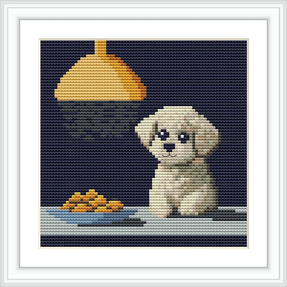 A cute puppy sits on a table under a hanging light, with a plate of food nearby.
