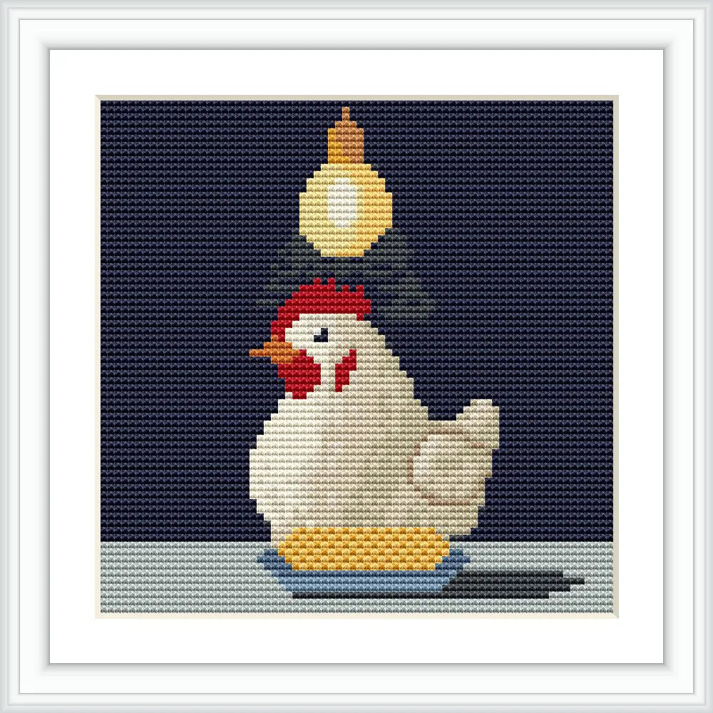 A hen sits on a plate with corn, under a hanging light bulb against a dark background.