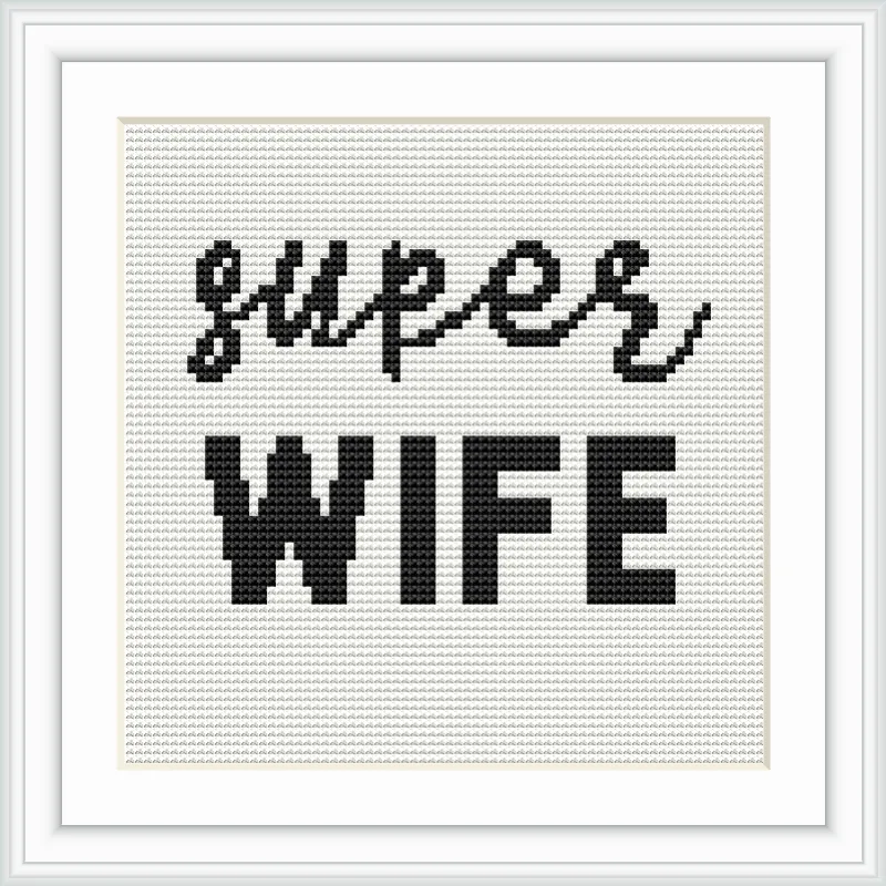 A cross stitch pattern featuring the words 'Super Wife' in two different fonts: a cursive style for 'Super' and a bold font for 'WIFE'. The text is centered in a white frame.