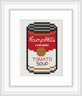 The image features a cross stitch depiction of a Campbell's tomato soup can, centrally located in a frame, highlighting its iconic design.