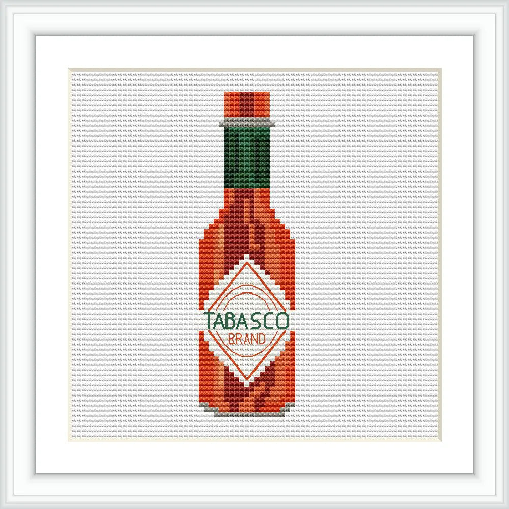 The image shows a cross stitch of a Tabasco hot sauce bottle, centrally positioned within a framed border.