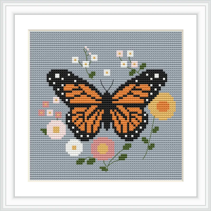A monarch butterfly is centrally located, surrounded by an array of small, colorful flowers with green stems and leaves against a soft gray background.