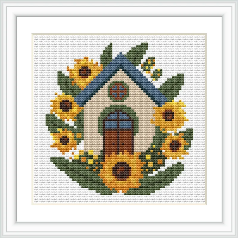 The image features a small, charming cottage with a blue roof and brown door, surrounded by bright sunflowers and green leaves.