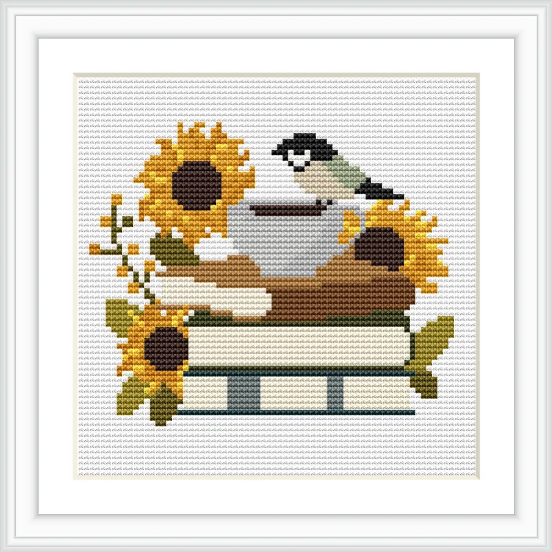The image features a small bird perched on a stack of two books, surrounded by sunflowers. The books and flowers are arranged neatly, with the bird sitting on top of one flower. The scene is simple and cozy.