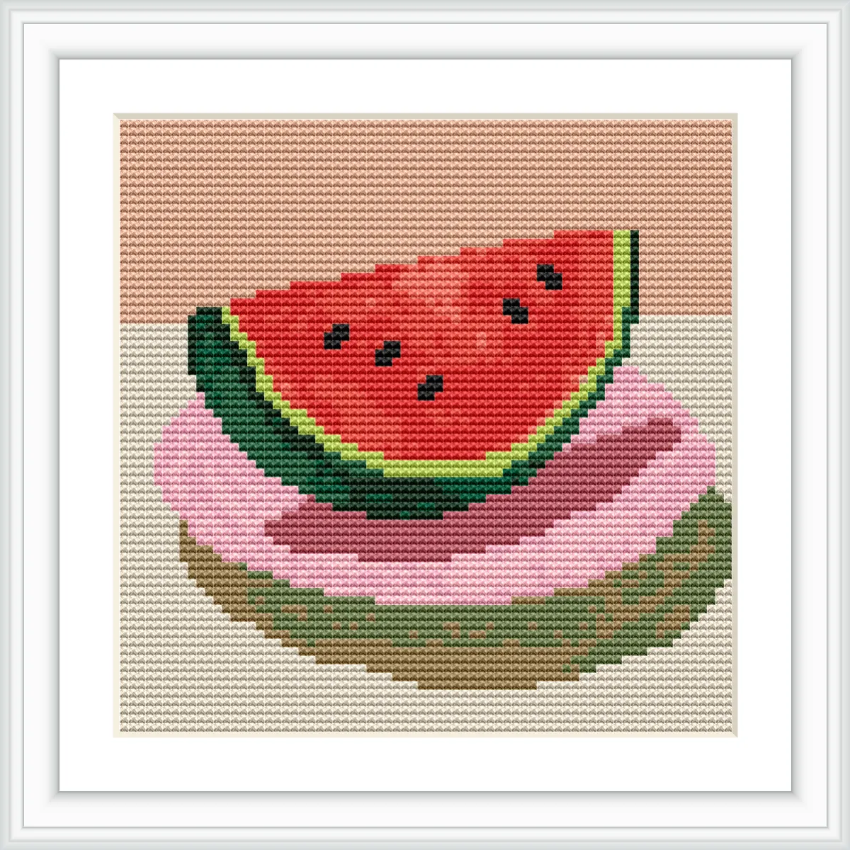 A slice of watermelon with green rind and red flesh is placed on top of two colorful plates on a beige background.