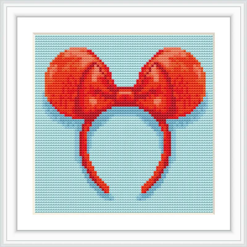 The image displays a red bow with round ears, reminiscent of a famous cartoon mouse, set against a light blue background.