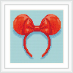 The image displays a red bow with round ears, reminiscent of a famous cartoon mouse, set against a light blue background.