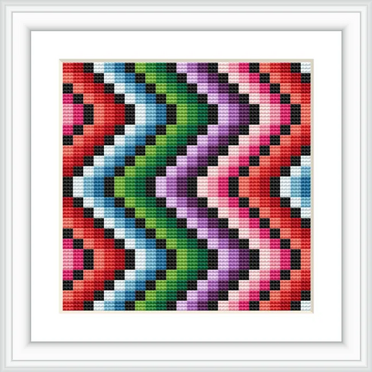 The image depicts a colorful geometric zig zag pattern, symmetrically arranged with vibrant colors such as red, green, purple, pink, and black, creating a striking visual effect.