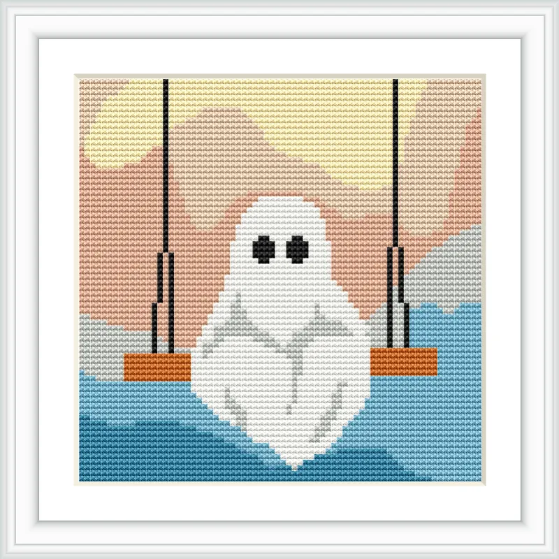 A small ghost sits on a swing suspended by black ropes, with a backdrop of blue water and a peach sky.