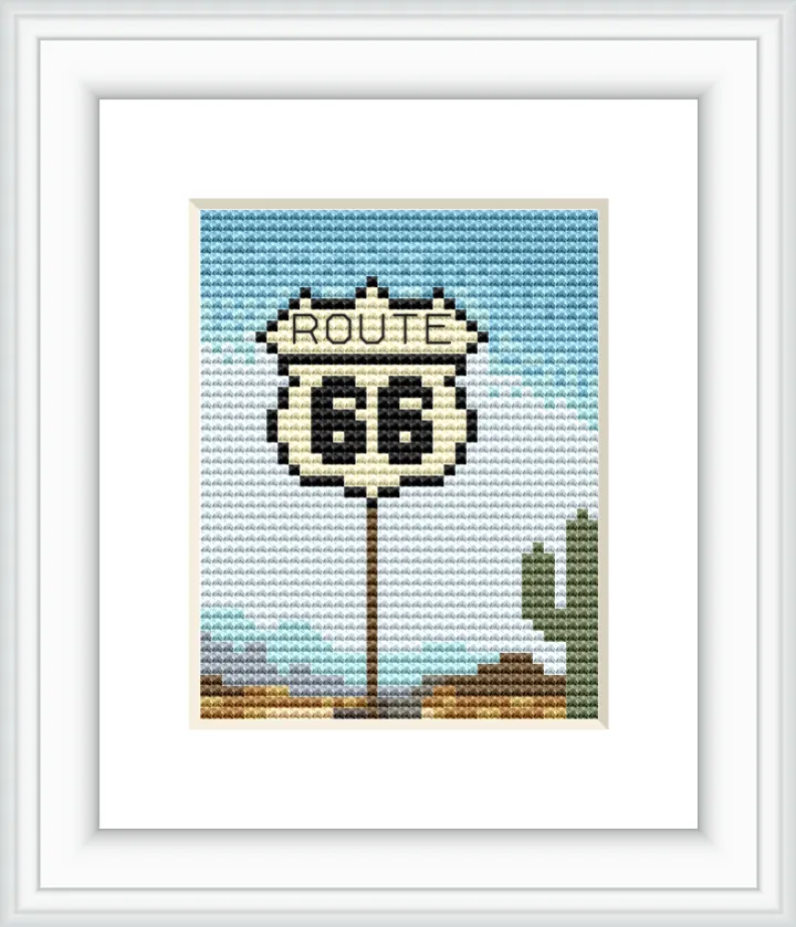 The image features a Route 66 road sign set against a blue sky with a distant brown landscape and a green cactus.