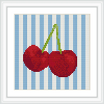 The image features two cherries with green stems against a background of vertical blue and white stripes, framed in a white border.