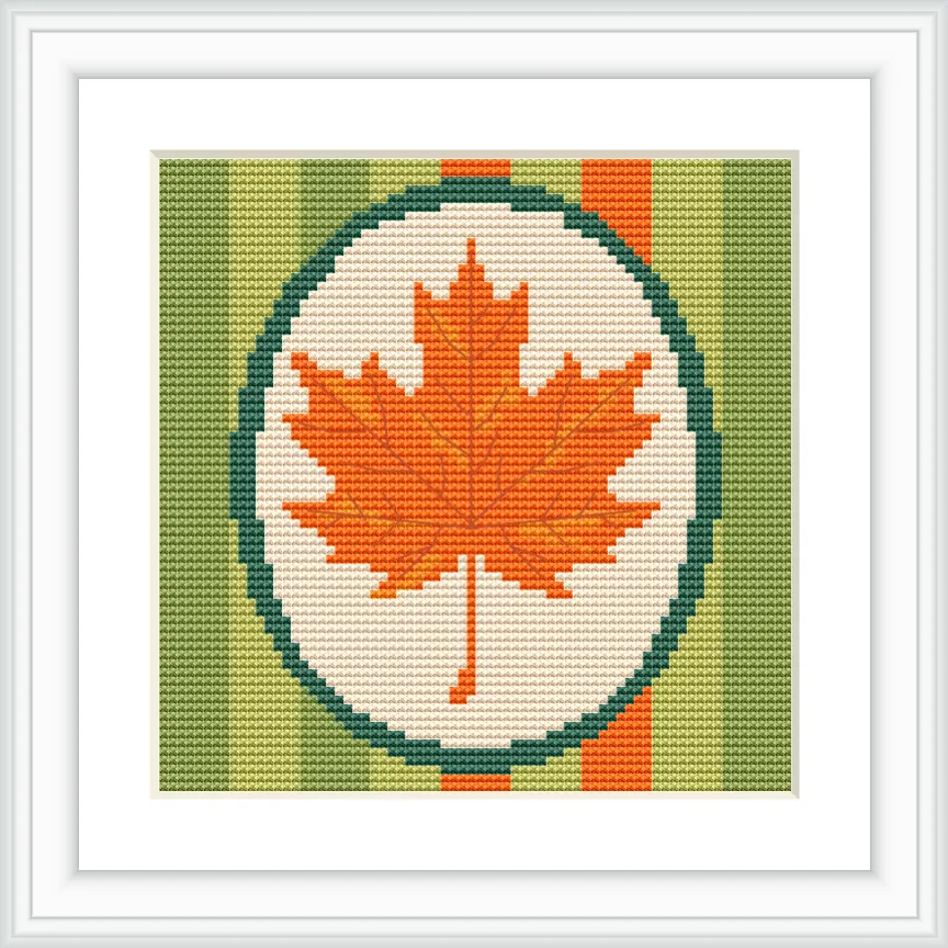 The image shows an orange maple leaf centered within an oval frame set against a striped green and orange background.