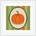 The image shows a single orange pumpkin with a brown stem at the center, encircled and placed against vertically striped green and orange background.