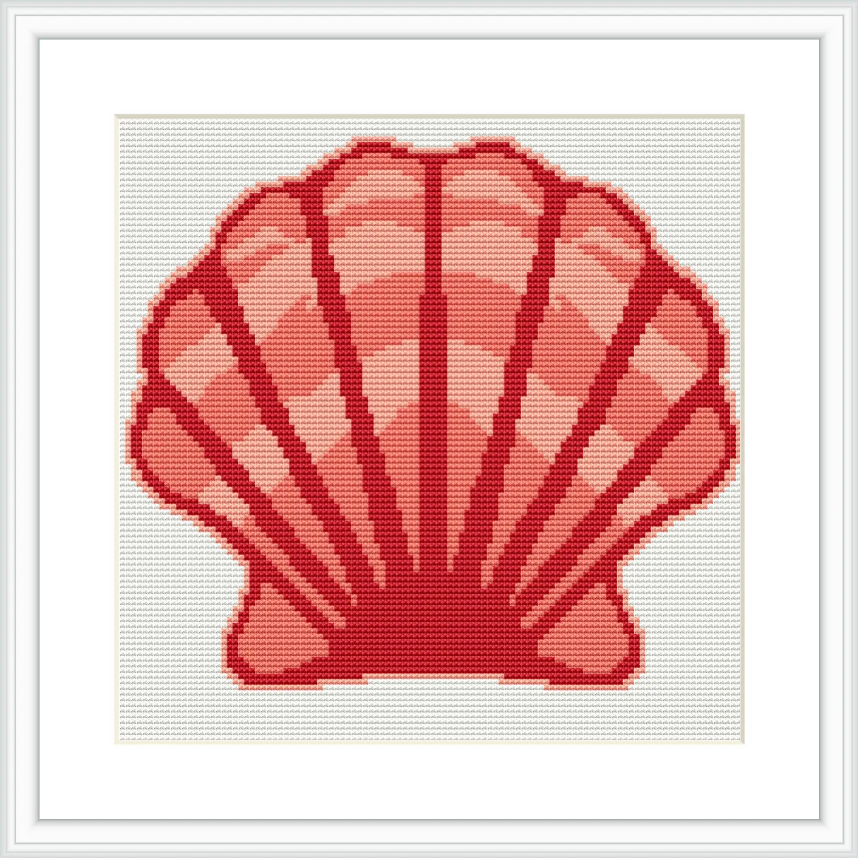 The image features a cross stitch pattern of a large pink scallop shell, centrally positioned on a white background and framed in a simple frame.