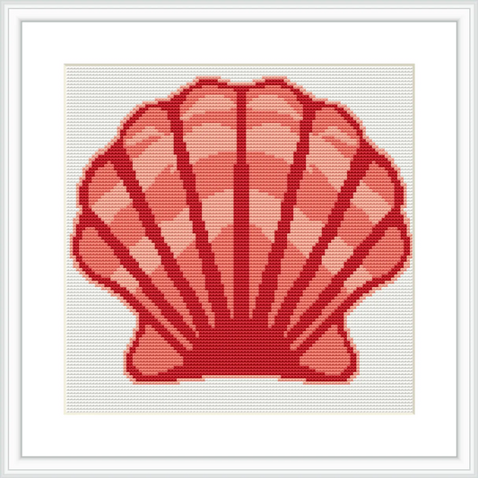 The image features a cross stitch pattern of a large pink scallop shell, centrally positioned on a white background and framed in a simple frame.
