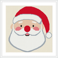 The image shows a cross stitch pattern of Santa Claus's face with a red hat, white beard, and pink cheeks. The design is bordered by a white frame.