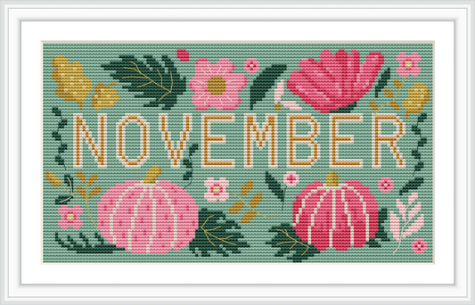 The image displays the word 'November' surrounded by pink pumpkins and vibrant flowers, all set against a green background with scattered leaves.