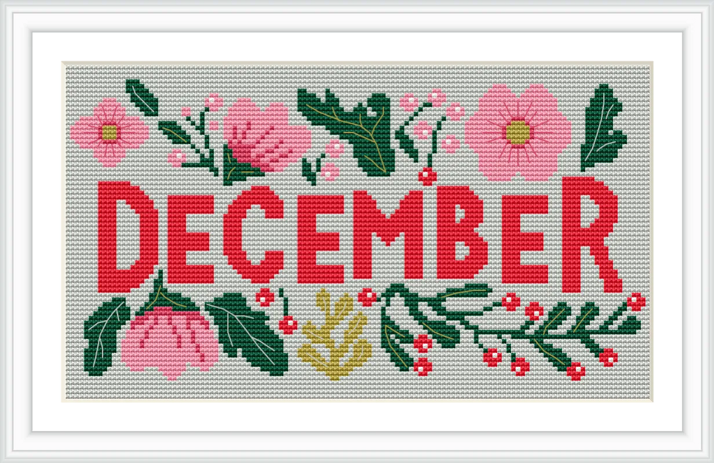 The image displays the word 'December' in bold, red uppercase letters surrounded by pink flowers, green leaves, and red berries on a creamy background.