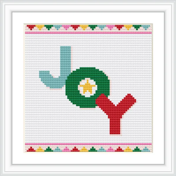 The image features the word 'Joy' in a cross stitch design. The letter 'J' is turquoise, 'O' is green with a white and yellow center, and 'Y' is red. The pattern is framed with a colorful border of small geometric shapes.