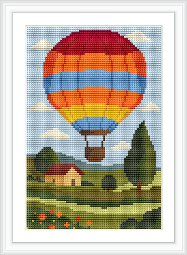 A vibrant hot air balloon with red, orange, and blue stripes floats over a pastoral landscape. Below, a yellow house with a red roof sits among trees and flower-dotted fields under a blue sky with fluffy clouds.