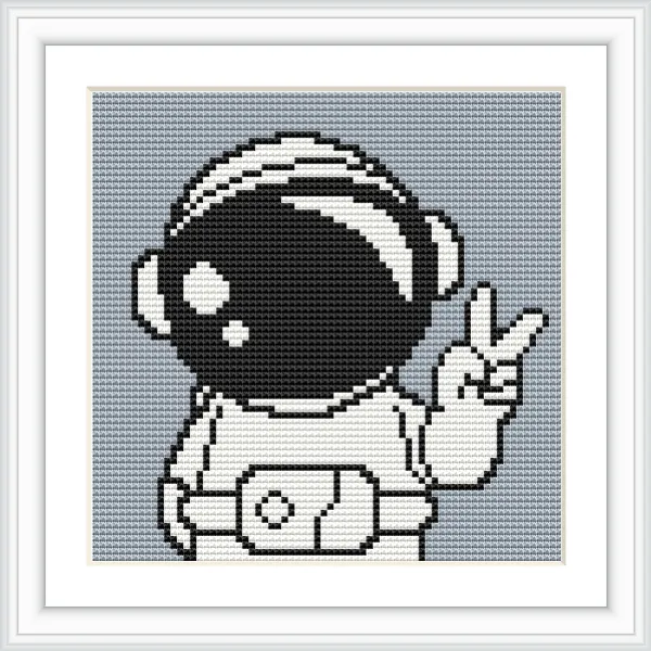 The image shows an astronaut in a suit, giving a peace sign with their right hand. The helmet is large and reflective, with a simple background.