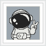 The image shows an astronaut in a suit, giving a peace sign with their right hand. The helmet is large and reflective, with a simple background.